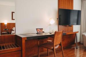 A television and/or entertainment centre at Time Select - Elegant Apartments