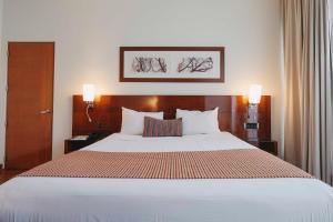 A bed or beds in a room at Time Select - Elegant Apartments