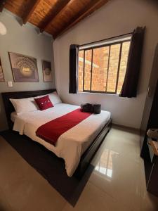 Postel nebo postele na pokoji v ubytování International Hotel Medellín