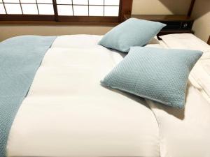 Ένα ή περισσότερα κρεβάτια σε δωμάτιο στο 越後湯沢石打Nozomi ski in ski out