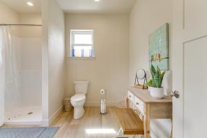 a bathroom with a toilet and a shower at Home 21 Mi to Glacier Natl Park Boat, Fish, Hike in Columbia Falls +21 photos