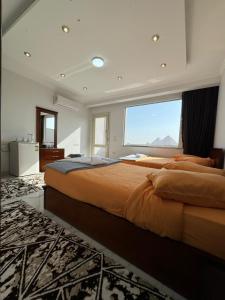 Postel nebo postele na pokoji v ubytování NEW ASSER HOTEL PYRAMID + 37 fotografií