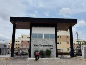 a building with a large window in a parking lot at Condomínio São Francisco in Petrolina