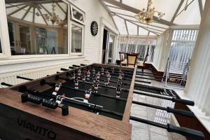 a room with a pool table in the middle at Blossom House* For Large Groups* Near Sutton Park* in Birmingham