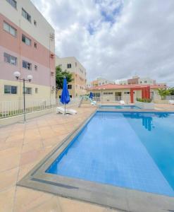 a large swimming pool in front of a building at Condomínio São Francisco in Petrolina