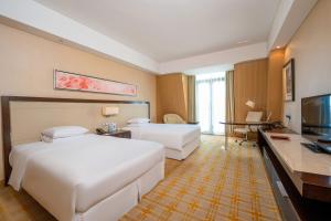 TV a/nebo společenská místnost v ubytování Sheraton Qinhuangdao Beidaihe Hotel