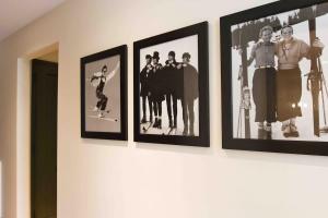a group of pictures hanging on a wall at Spruce Peak Resort luxury 3 Bedrm 2levelApartment in Stowe