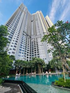 a large building with a swimming pool in front of it at My Service Suites Agile KL in Kuala Lumpur