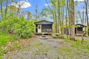 a cabin in the middle of the woods at Family Cabin full bath in Gaines