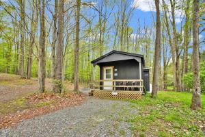a tiny house in the middle of the woods at Family Cabin full bath in Gaines