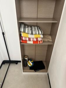 a walk in closet with some towels at Punta Conejo Camila bungalows Surf Camp in Reparo