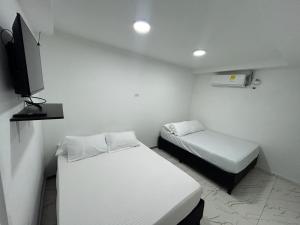 Postel nebo postele na pokoji v ubytování Lago Hotel