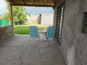 two chairs and a table on a patio at Casa Simón in San Rafael