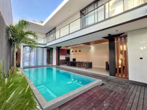 an image of a swimming pool in a house at Villa Shinta1 with 3 BR, Pool & WiFi in Ungasan Bali by Damaresa in Uluwatu