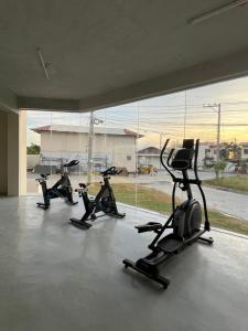 a group of four exercise bikes in a gym at Raph Staycation near Mactan Newtown in Lapu Lapu City