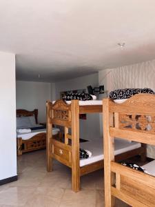 Llit o llits en una habitació de Hotel Estaciones