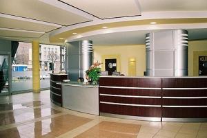 a lobby with a reception desk in a building at Hotel Kujawy in Włocławek