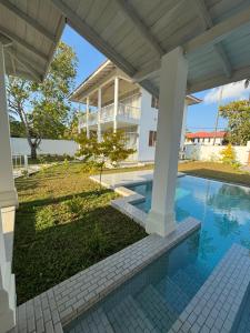 an image of a house with a swimming pool at Interlanka Coast Living in Ahangama