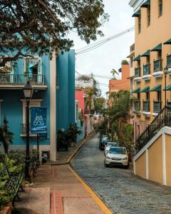 a street in a city with cars parked at New! Cozy Cool Studio Near Beach! in San Juan