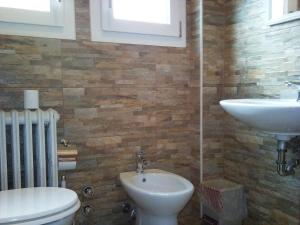 a bathroom with a sink and a toilet at Hotel Bristol in Sesto San Giovanni +50 photos