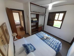 Ένα ή περισσότερα κρεβάτια σε δωμάτιο στο Casa Super Confortável Jardim a pé Praia Geribá