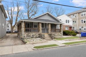 a house on a street with at Stylish 3 bedroom near Downtown Providence & Providence College in Providence