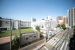 a view of a city street with buildings at Color Tsuruhashi in Osaka +69 photos