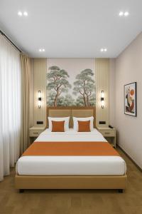 Postel nebo postele na pokoji v ubytování Nizami Central Park Hotel
