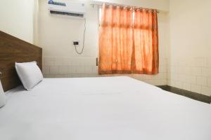 Ένα ή περισσότερα κρεβάτια σε δωμάτιο στο SPOT ON Hotel Anand Bhawan +38 φωτογραφίες