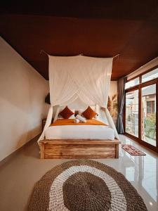 Ένα ή περισσότερα κρεβάτια σε δωμάτιο στο Mount Batur sunrise Jeep and Lodge