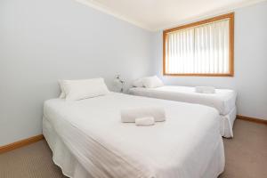 Ένα ή περισσότερα κρεβάτια σε δωμάτιο στο Birchgrove Terrace 5 +7 φωτογραφίες