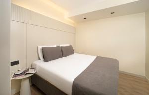 Postel nebo postele na pokoji v ubytování Orka Taksim Apart Hotel