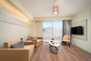 TV a/nebo společenská místnost v ubytování Orka Taksim Apart Hotel