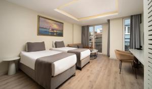 Postel nebo postele na pokoji v ubytování Orka Taksim Apart Hotel