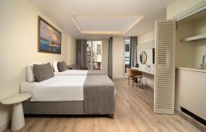 Postel nebo postele na pokoji v ubytování Orka Taksim Apart Hotel