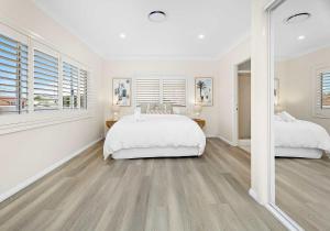 Letto o letti in una camera di Shellharbour Poolside Escape