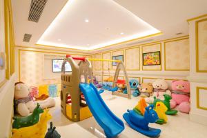 a childrens play room with a slide and toys at Dalat Palace Heritage Hotel in Da Lat