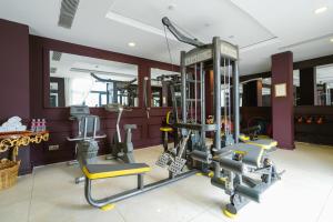 a gym with two tread machines in a room at Dalat Palace Heritage Hotel in Da Lat