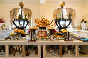 a buffet of food on display in a store at Dalat Palace Heritage Hotel in Da Lat