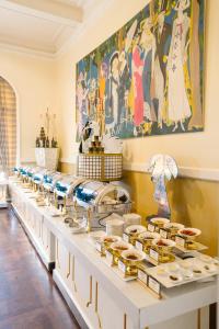 a buffet line with many different types of food at Dalat Palace Heritage Hotel in Da Lat