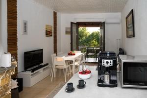 a living room with a table with a coffee maker at Step to Paradise in Pelion in Agios Ioannis Pelio