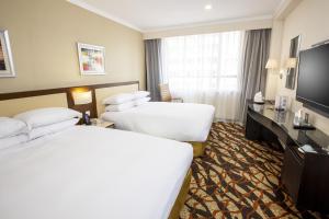 Postelja oz. postelje v sobi nastanitve Metropark Hotel Kowloon