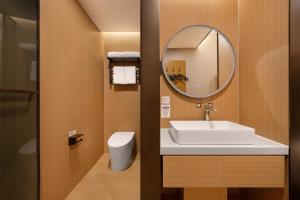 Ένα μπάνιο στο Baiman Hotel Beijing South Railway Station Heyi Subway Station Branch