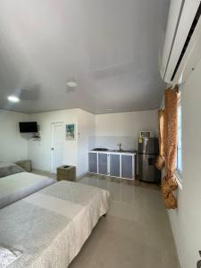 Postel nebo postele na pokoji v ubytování Posada Three Cay Suites