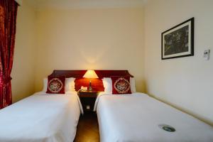 Voodi või voodid majutusasutuse Du Parc Hotel Dalat toas
