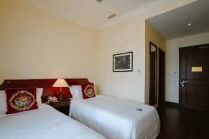 Voodi või voodid majutusasutuse Du Parc Hotel Dalat toas
