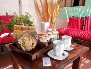 a coffee table with a tray of food on it at Alojamiento Naomi 1 in Villa Unión