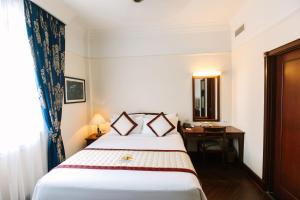 Voodi või voodid majutusasutuse Du Parc Hotel Dalat toas