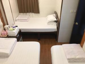 Cama o camas de una habitación en Hk Peace Guest House