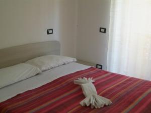Postel nebo postele na pokoji v ubytování Hotel Aurora